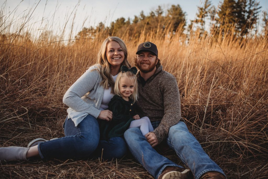 Owner of Sunset Pools, Chance Schuldt, together with his wife, Jessi, and daughter, Harper.